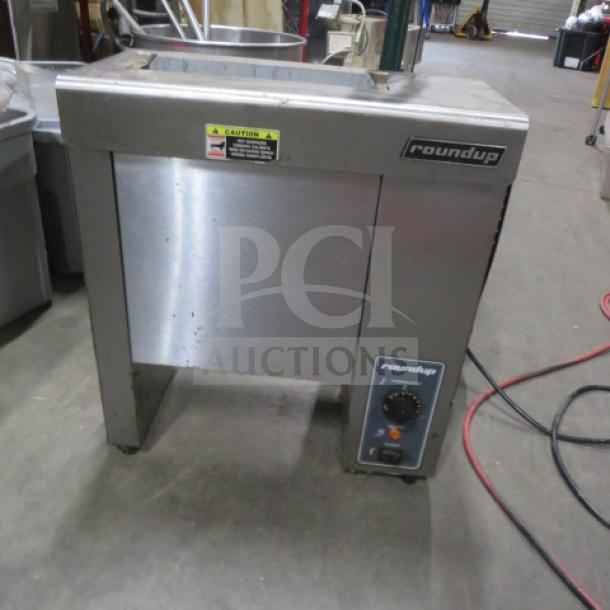 Roundup VCT-1000CF conveyor toaster, stainless steel, 120V, with control panel and caution label, used condition.