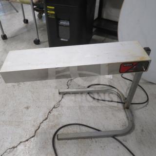 Nemco 6152-24 Food Warmer, 120V, 500W, measures 25"x14"x17", silver, visible wear; logo and controls on front.