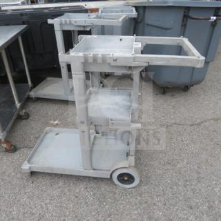 Rubbermaid Janitor Cart on casters, model 6152-02, durable gray plastic, multi-shelf, includes handle, $390.00.
