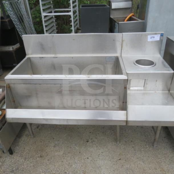 Stainless steel ice well with speed rail, add-on blender shelf, and small sink. Dimensions: 49x25x38 inches. Used.