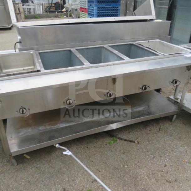 Industrial electric steam table with five wells, under shelf, stainless steel, 72x30x34 inches, used condition.