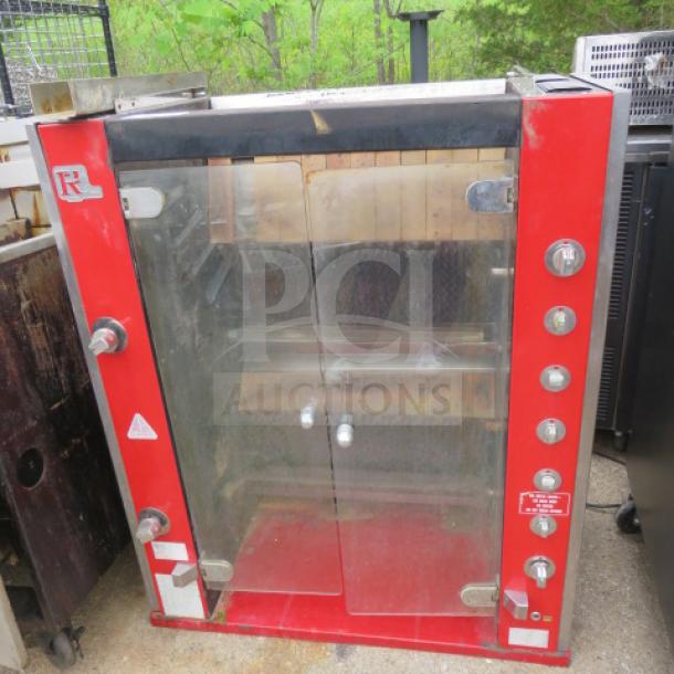 Rotisol rotisserie, model 38X20X45, red and steel, glass doors, control knobs on side, used condition.