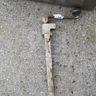 Heavy-duty 10lb can opener with long metal handle and visible rust, numbered tag attached, used condition.