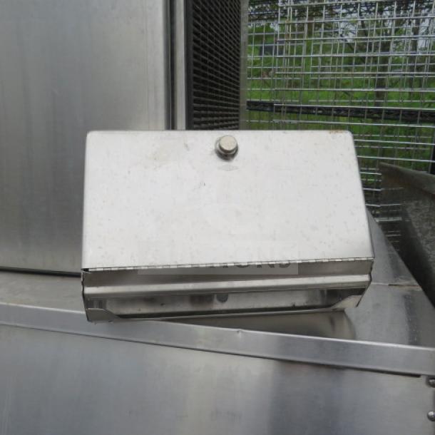 Bobrick stainless steel wall mount towel dispenser, used condition, visible mounting hardware, suitable for commercial use.