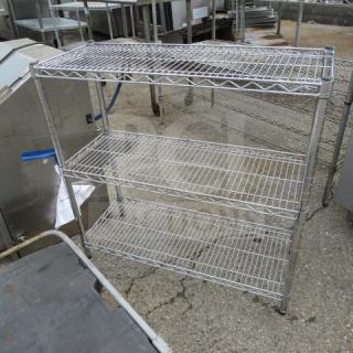 Metro three-shelf unit, 36x14x35 inches, metal construction, used condition, ideal for storage and organization.