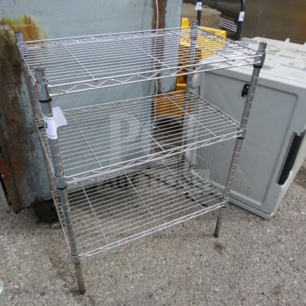 Three-shelf Metro wire shelving unit, 324x14x30 inches, chrome finish, sturdy metal frame, good condition.