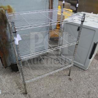 Three-shelf Metro wire shelving unit, 324x14x30 inches, chrome finish, sturdy metal frame, good condition.