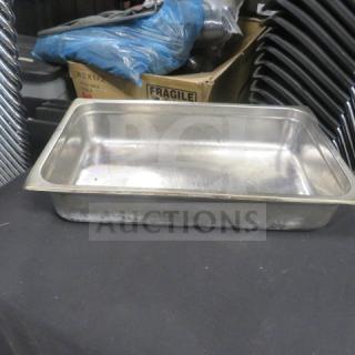 Full-size 4-inch deep stainless steel hotel pan. Used condition with some wear, no visible dents. Ideal for catering use.