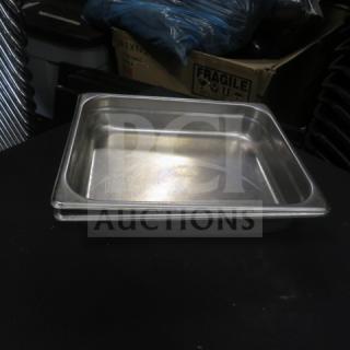 Half size 4-inch deep hotel pan, stainless steel, lightly used condition, stackable, suitable for commercial kitchens.