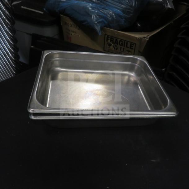 Half Size 4 Inch Deep Hotel Pan, stainless steel, used condition, stackable, ideal for commercial kitchen use.