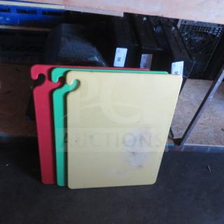 Set of three 24x18 hook cutting boards in red, green, and yellow, showing wear marks, ideal for kitchen use.