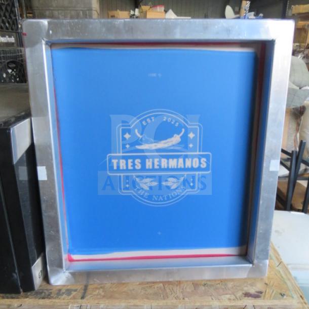 18x20 framed picture with "Tres Hermanos" logo, established 2023. Blue background, silver metallic frame in good condition.