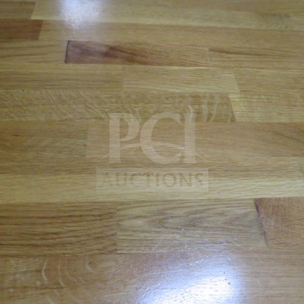 Butcher block table with pedestal base, dimensions 48x30x30 inches, showing smooth wood grain surface.