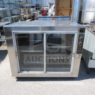 NUVU 2 Door Warmer/Proofer on casters, 48x31x41 inches. Stainless steel exterior, sliding glass doors, control panel visible.