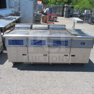 One Pitco 3 Bay Electric Fryer With Warming Station With A Hatco Warmer, GRFSC-24, On Casters. 208 Volt. 3 Phase. #FE18S-CQV. 81X38X40. $39,226.00