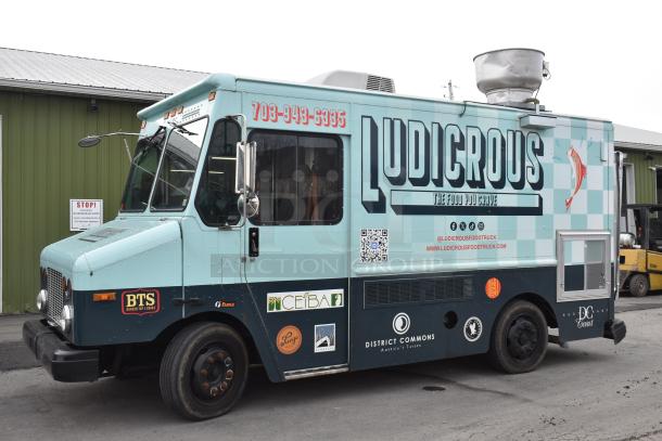 2002 Freightliner MT45 18' food truck, Ludicrous wrap, propane hookup, grease hood, fryer, griddle, grill, serving window.
