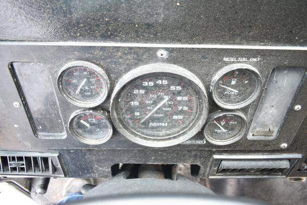 Dashboard gauges of a 2002 Freightliner MT45 food truck showing speedometer, oil pressure, fuel level, and temperature.