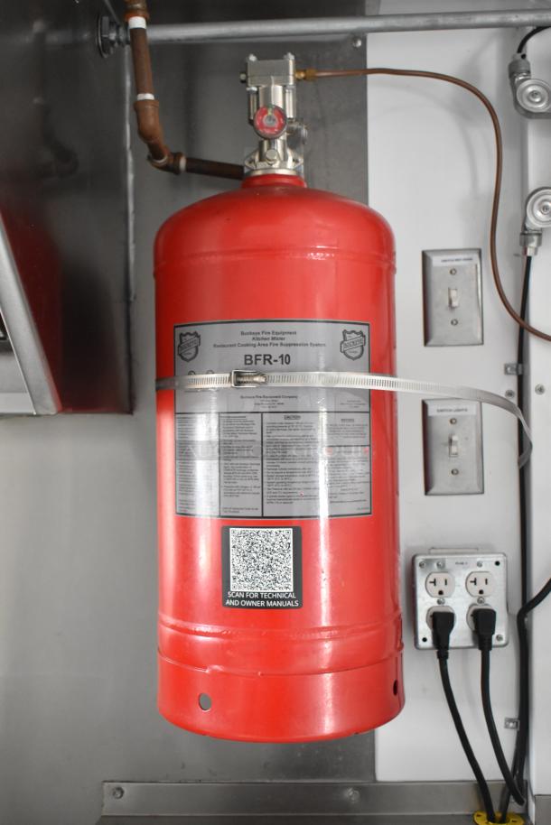Red Buckeye BFR-10 fire suppression system in Freightliner MT45 food truck, mounted near electrical outlets and switches.