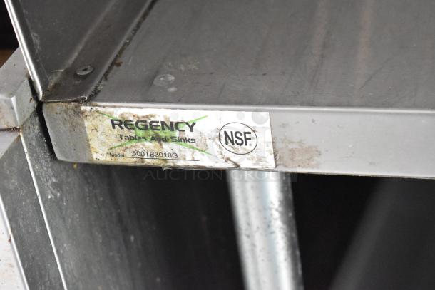 Regency stainless steel table corner, model 600TB3018G, with NSF certification label, slightly worn condition.