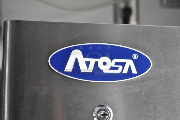 Atosa logo on stainless steel surface of 2002 Freightliner MT45 food truck, highlighting equipment brand.