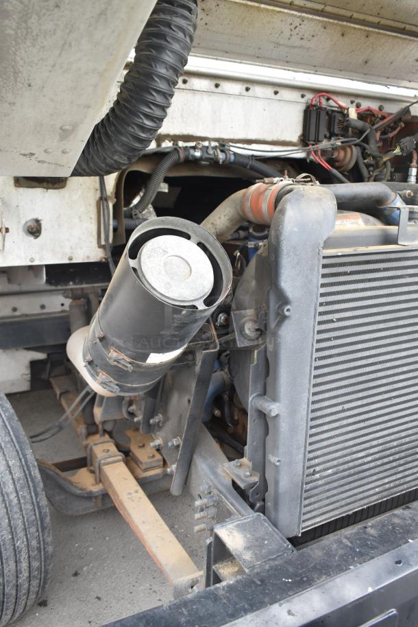 2002 Freightliner MT45 food truck engine view, showing radiator and engine components, in used condition.