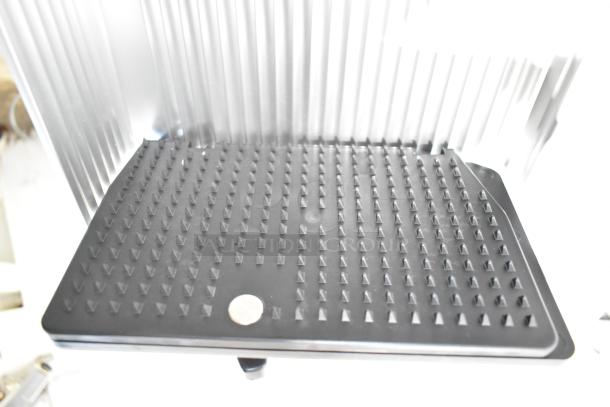 2023 Bizerba GSP HD commercial meat slicer, showing the textured meat grip tray. Model for durability in food prep.