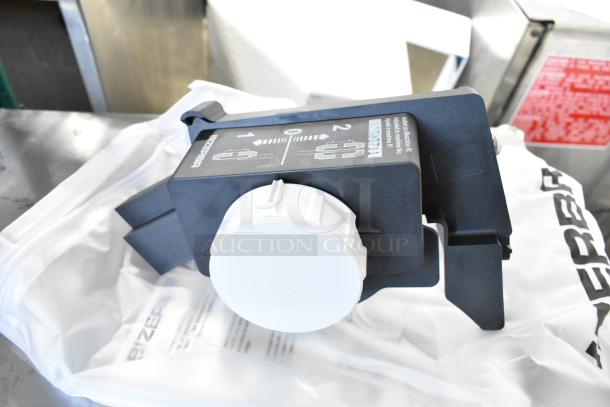 2023 Bizerba GSP HD Commercial countertop meat slicer component, showing adjustment knob with Bizerba branding.