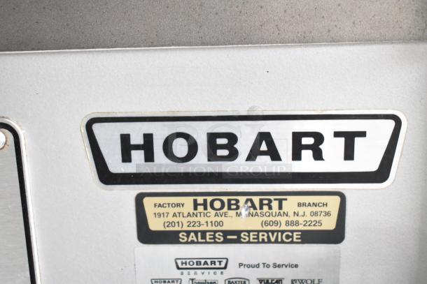 Hobart P660 commercial dough mixer label showing brand, factory address, and service contact information.