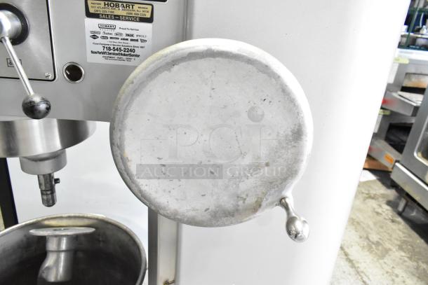 Hobart P660 commercial 60-quart dough mixer with metal mixing bowl, dough hook, visible metal finish, and control panel details.