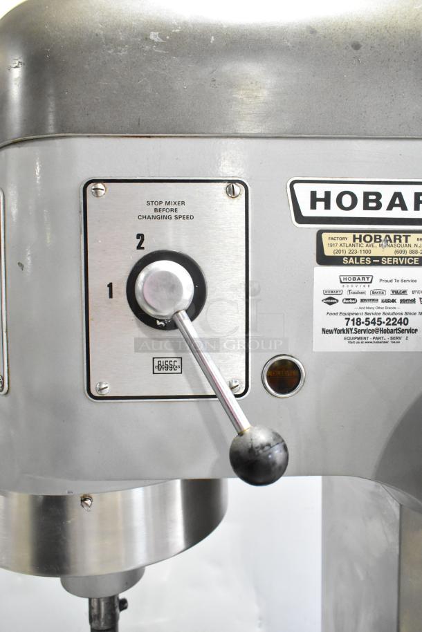 Hobart P660 metal commercial dough mixer, 60-quart capacity, includes metal mixing bowl and dough hook. Model details visible.