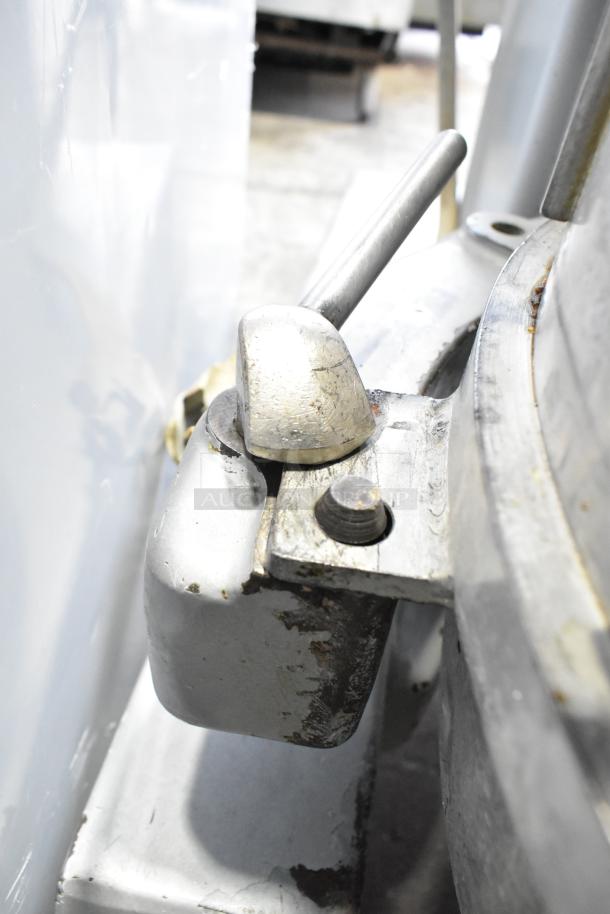 Hobart P660 commercial dough mixer detail showing metal lever and casing, with visible wear, suitable for heavy-duty use.
