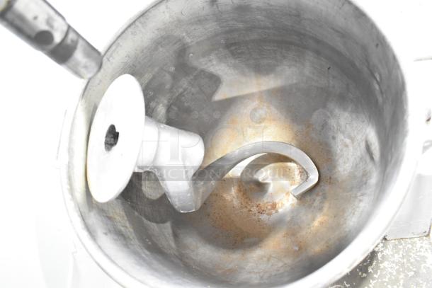 Hobart P660 60-quart commercial dough mixer with metal bowl and dough hook. Shows signs of wear. 240V, 1 phase.