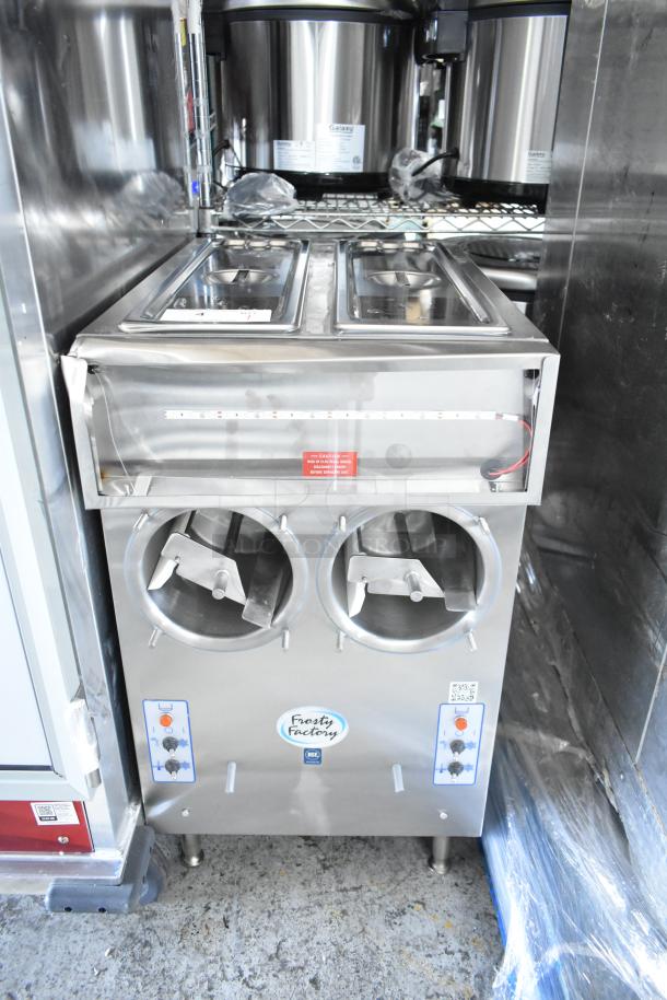Brand new Frosty Factory 217W frozen cocktail machine, 16 Qt., double cylinder, water-cooled, 115V, 1 phase, with minor scratches.