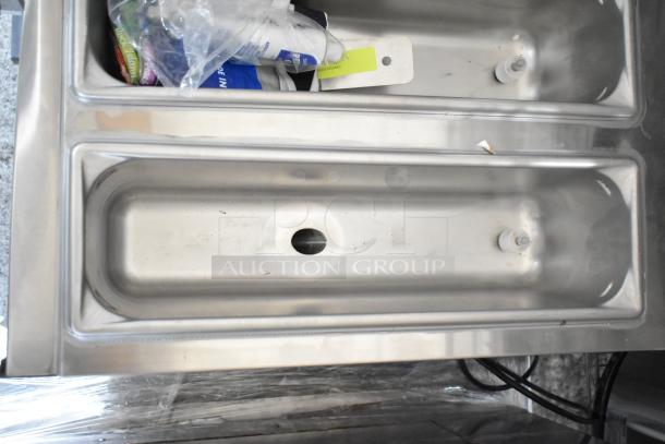 Brand new Frosty Factory 217W commercial frozen cocktail machine, 16 Qt. double cylinder, water-cooled, 115V, scratch and dent condition.