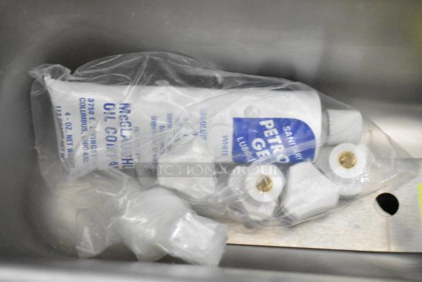 Brand new 2026 Frosty Factory 217W Frozen Cocktail Machine parts in plastic bag; includes lubricant and fittings.