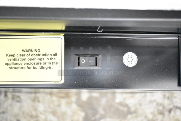 Beverage Air MT23-1 B 18 Merchandiser switch panel with warning label on ventilation clearance.