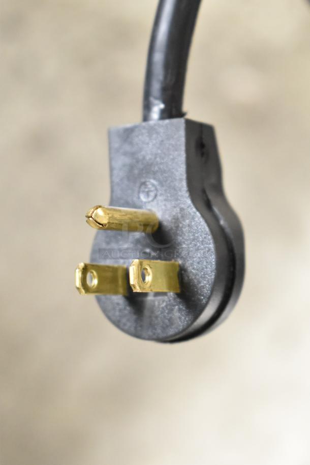 Black plug with three brass prongs for the Beverage Air MT23-1 B 18 refrigerated merchandiser.