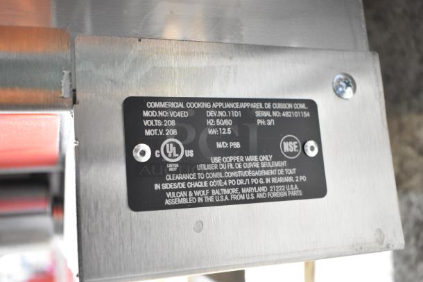Label close-up of Vulcan VC4ED commercial convection oven, showing model, serial number, voltage, and certification marks.