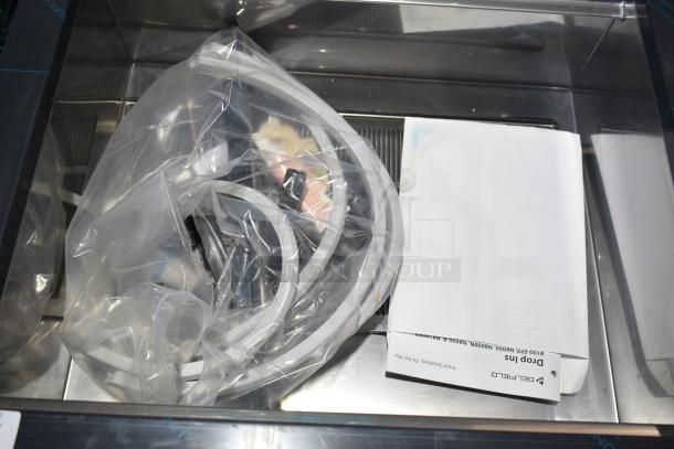 Brand new Delfield N8130BP drop-in refrigerated cold food well, 120V, 1 phase. Includes manuals and accessories.