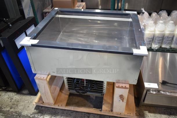 Alt text: Brand new 2024 Delfield N8130BP refrigerated cold food well, 120V, 1 phase, slight scratch and dent, on wooden pallet.