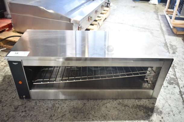 BRAND NEW Vollrath JW30PA 35" plate-activated countertop cheese melter, 240 volts, 1 phase, visible scratch and dent.