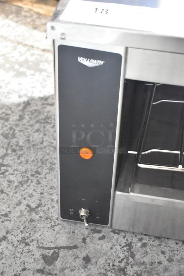 Brand new Vollrath JW30PA cheese melter, 35" plate-activated, countertop model, 240 volts, 1 phase, minor scratches.