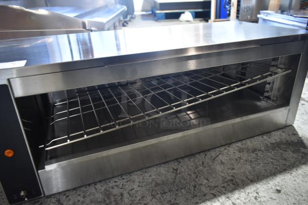 Brand new Vollrath JW30PA 35" cheese melter, plate activated, countertop model, 240V, 1 phase, minor scratches.
