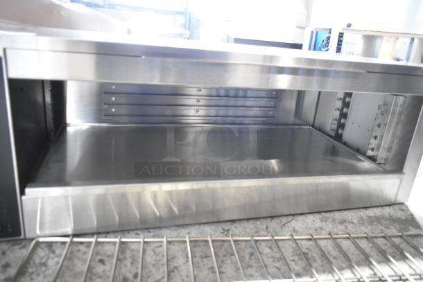 Vollrath JW30PA 35" Plate Activated Countertop Cheese Melter, stainless steel interior, 240V, 1 Phase, new with minor scratches.