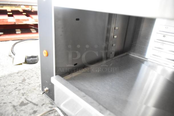 BRAND NEW Vollrath JW30PA 35" plate-activated countertop cheese melter. Scratch and dent condition, 240V, 1 phase.