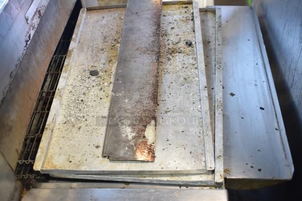 2021 Middleby Marshall DZ33T stainless steel conveyor pizza ovens, electric, 208V, tested, on casters, some wear visible.