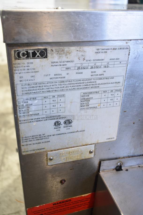 Middleby Marshall CTX DZ33I stainless steel conveyor pizza oven label showing model, serial number, and safety warnings.