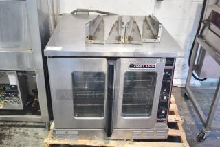 Garland Master 200 convection oven with view-through doors, thermostatic controls, metal legs; good condition.
