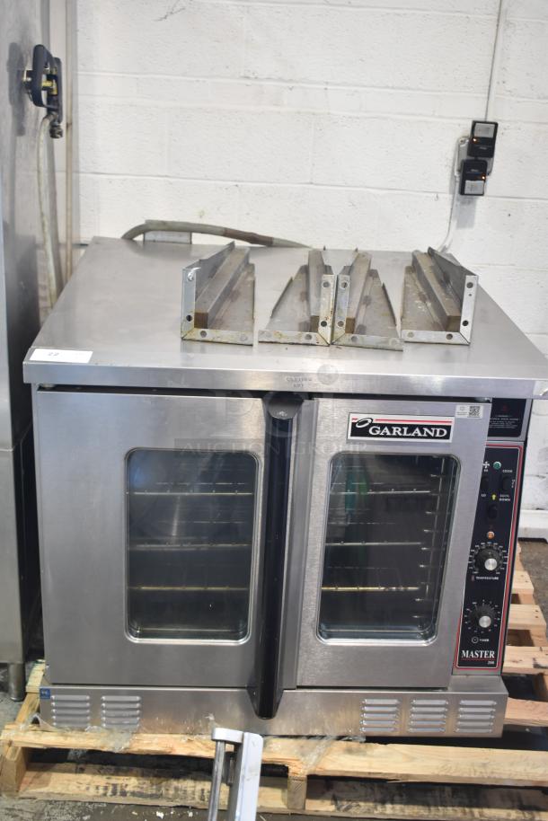 Garland Master 200 commercial convection oven with view-through doors, thermostatic controls, and metal legs.