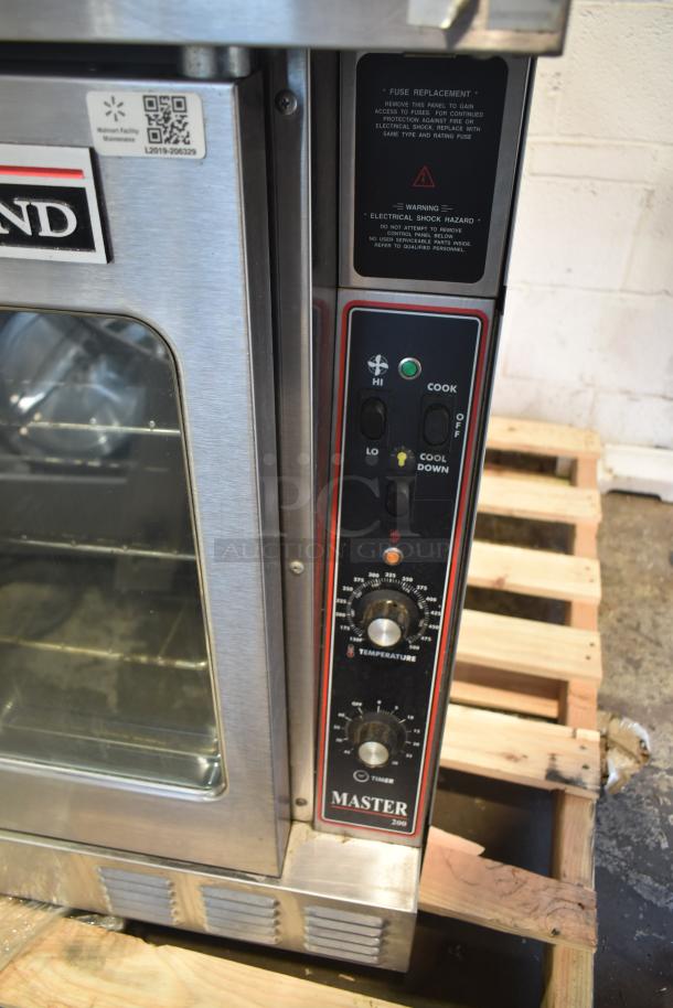 Garland Master 200 convection oven with view-through doors, thermostatic controls, metal legs, in good condition.